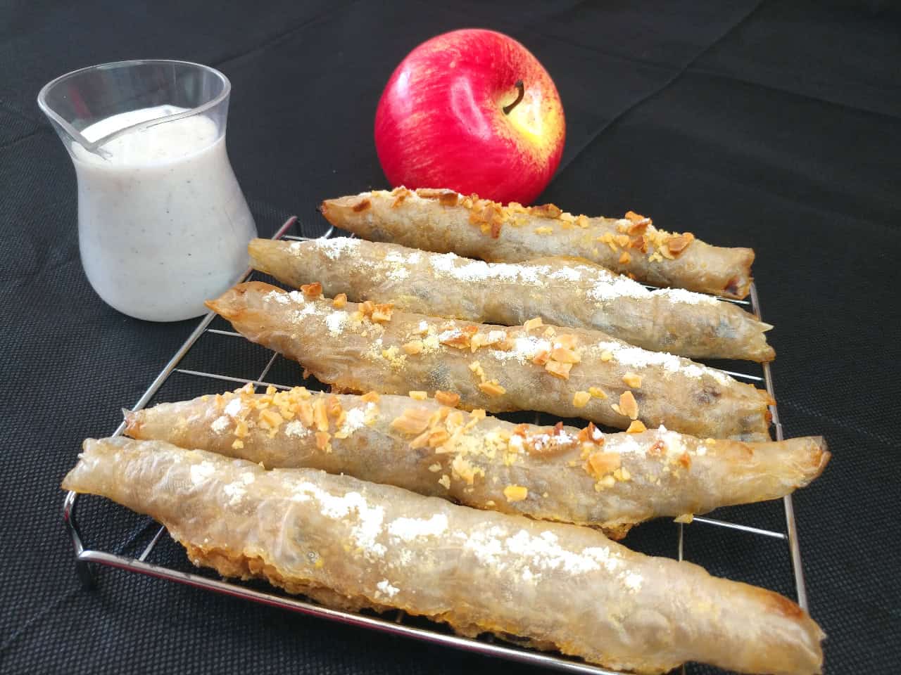 Gluten-free mini-strudel filled with apple and almond flour served with vegan vanilla sauce.